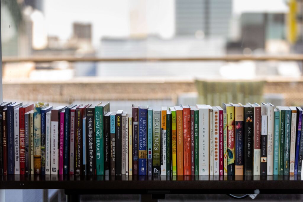 A row of books lined up on a table