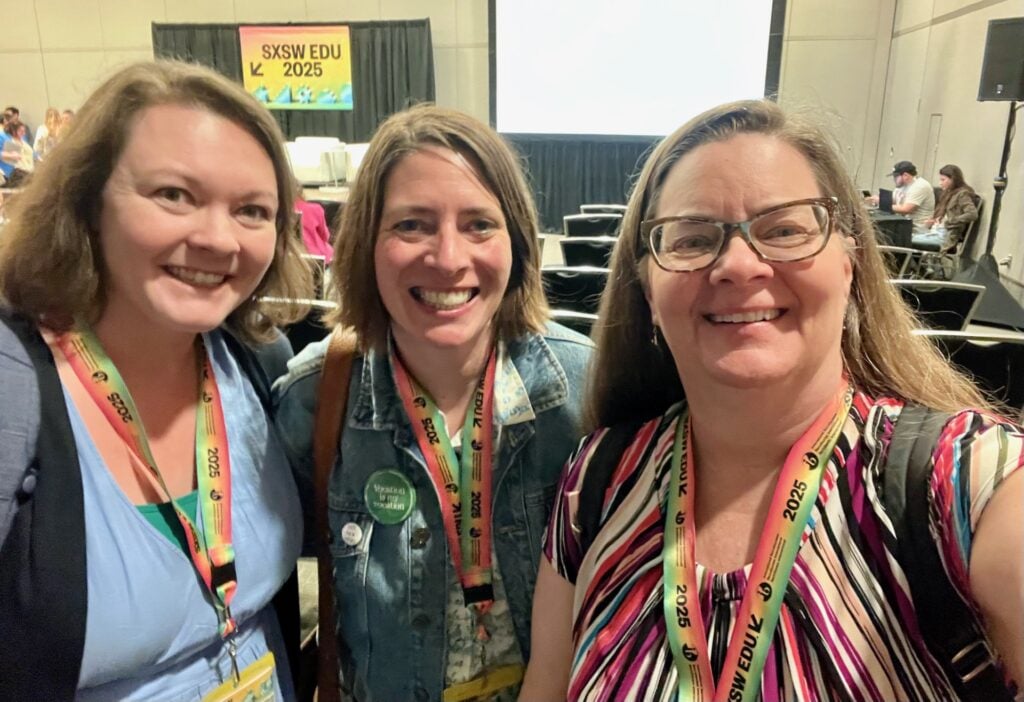 Three women smiling at the camer
