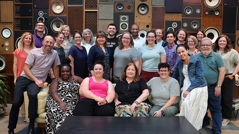 Group photo of participants seated and standing in rows