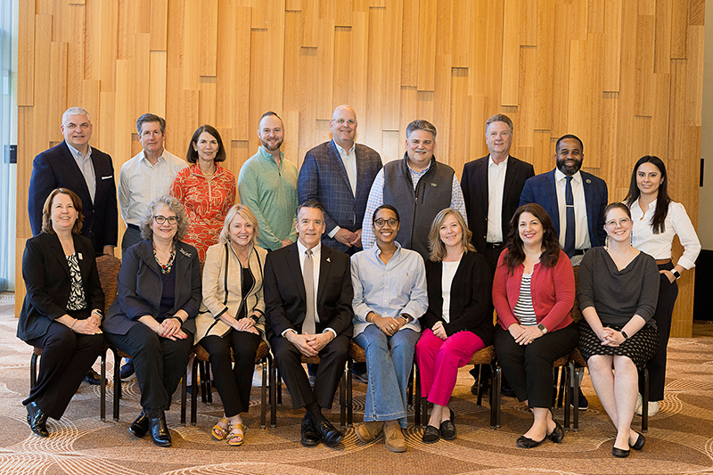 Participants seated and standing for group photo