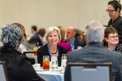 Participants and speakers engage during roundtable discussions