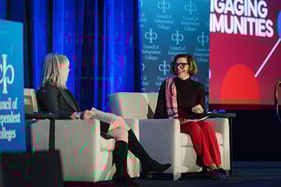 Marjorie Hass and Barbara Hetrick presenting from chairs on stage