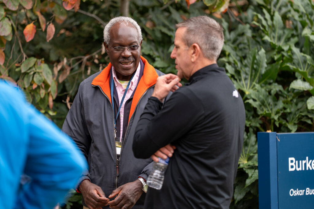 Two men talking in between sessions at the 2025 NetVUE regional gathering at Bushnell University