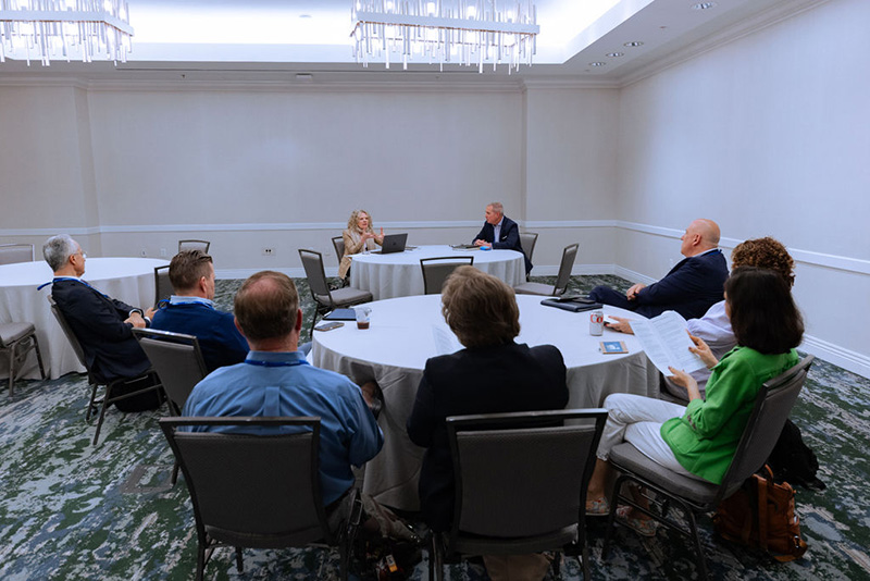 9 presidents seated around two round tables