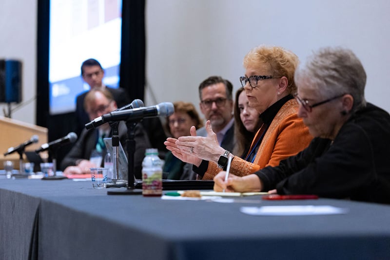 7 speakers present from head table and podium