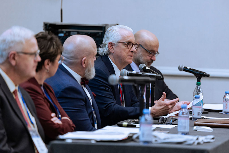 Five speakers seated at head table
