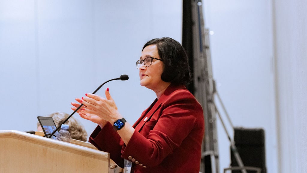 Speakers presents from podium