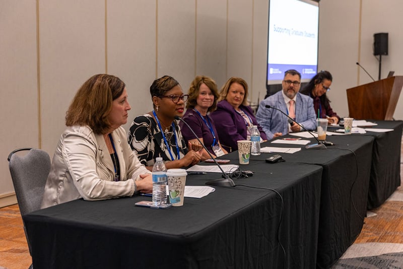 6 speakers seated at the head table