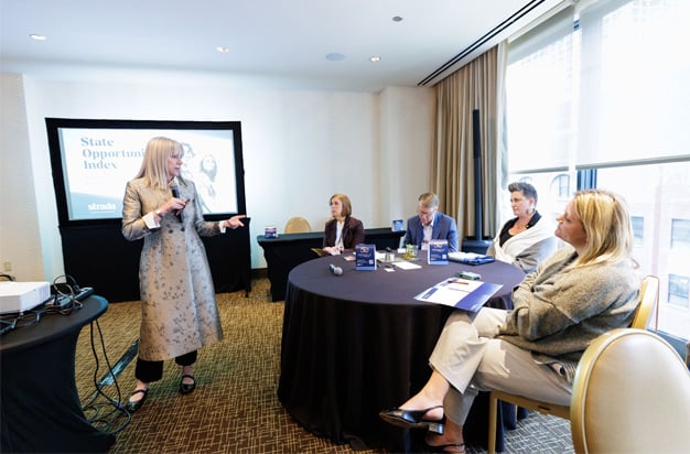 Marjorie Hass speaking to seated participants